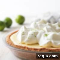 Τάρτα Τεκίλα Λάιμ 6 Αυτή η ανάλαφρη και κρεμώδης τάρτα λάιμ τεκίλας είναι ελαφριά, κρεμώδης και έχει μια διασκεδαστική «κλωτσιά»!
