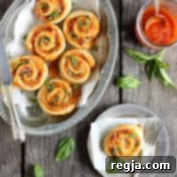 Ρολάκια Πίτσας με Ντομάτα Βασιλικό και Μοτσαρέλα 2 Ρολά Πίτσας με Ντομάτα, Βασιλικό και Μοτσαρέλα