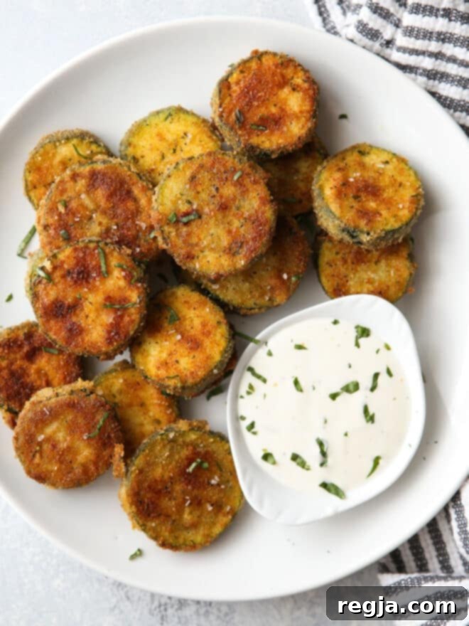Τραγανά Τηγανητά Κολοκυθάκια 6 crispy zucchini on a plate with ranch dressing
