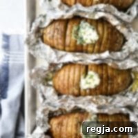 Ψητές Πατάτες Χάσελμπακ με Βούτυρο Σχοινόπρασου 6 «Ψητές» πατάτες μαγειρεμένες στη σχάρα και σερβιρισμένες με βούτυρο σχοινόπρασου