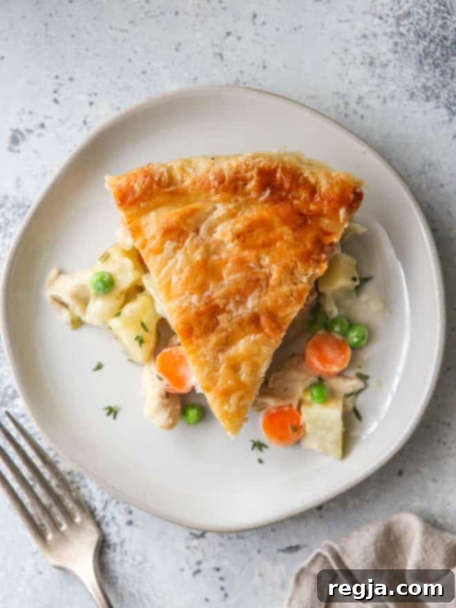 closeup of chicken pot pie slice on a plate