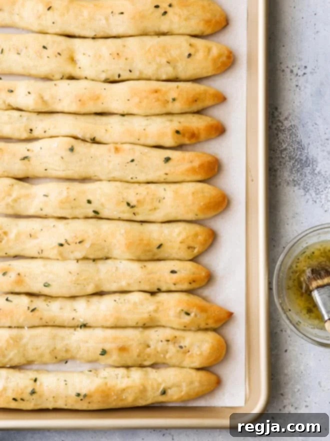 breadsticks fresh from the oven brushed with garlic herb butter