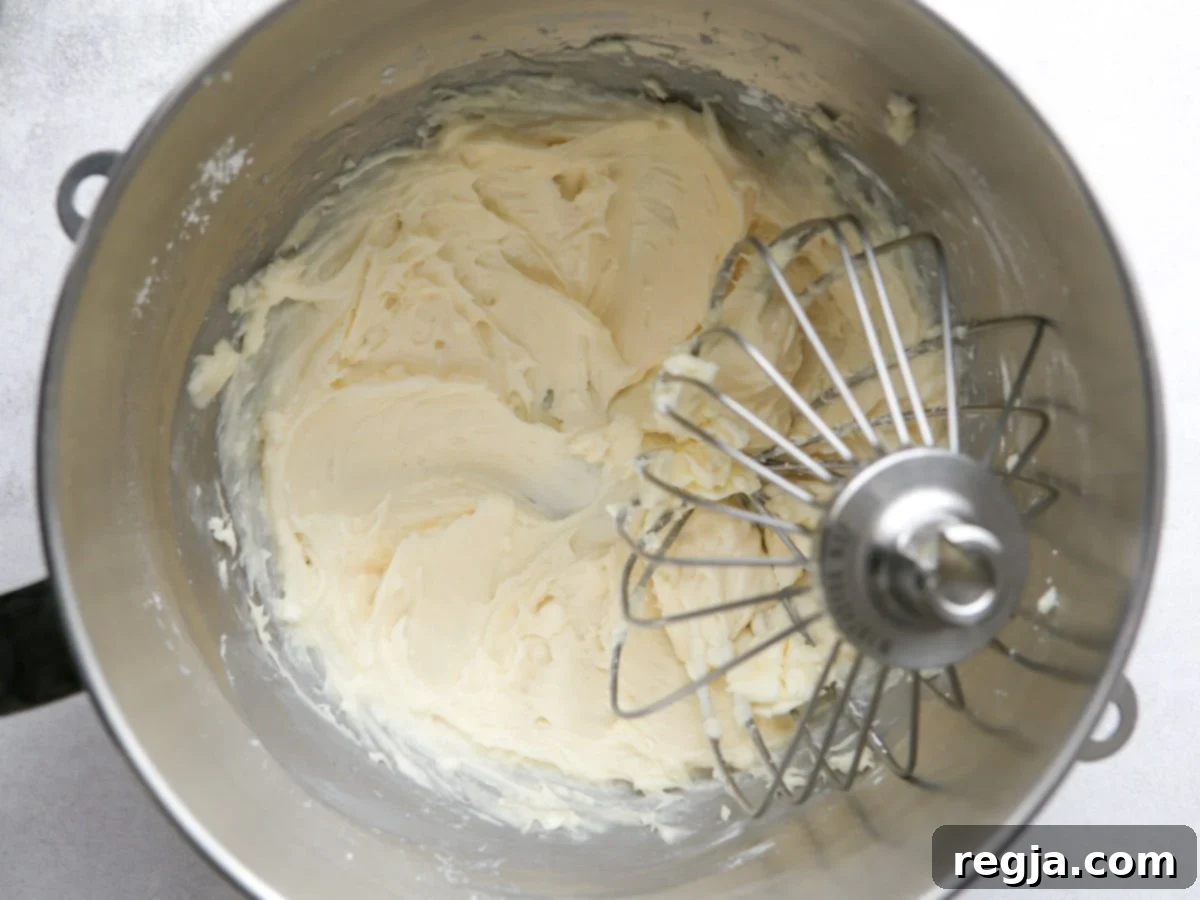 whisking cream cheese, sugar, vanilla and salt