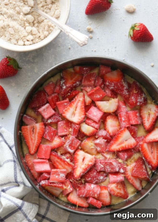 Making strawberry rhubarb coffee cake with streusel topping